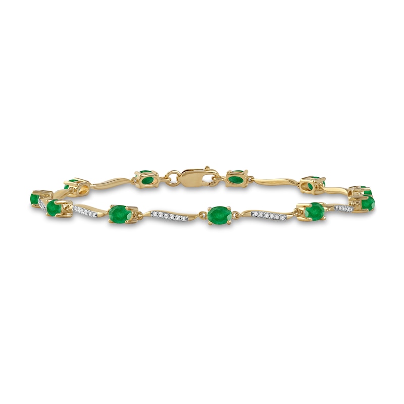 Oval Emerald and 1/6 CT. T.W. Diamond Wave Link Alternating Line Bracelet in 14K Gold – 7.25"