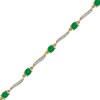 Thumbnail Image 1 of Oval Emerald and 1/6 CT. T.W. Diamond Wave Link Alternating Line Bracelet in 14K Gold – 7.25"