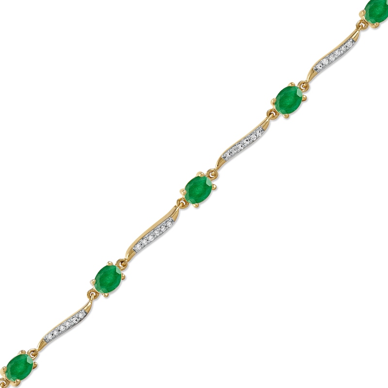 Oval Emerald and 1/6 CT. T.W. Diamond Wave Link Alternating Line Bracelet in 14K Gold – 7.25"