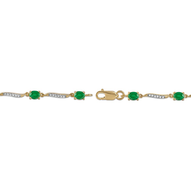 Oval Emerald and 1/6 CT. T.W. Diamond Wave Link Alternating Line Bracelet in 14K Gold – 7.25"