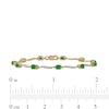 Thumbnail Image 3 of Oval Emerald and 1/6 CT. T.W. Diamond Wave Link Alternating Line Bracelet in 14K Gold – 7.25"