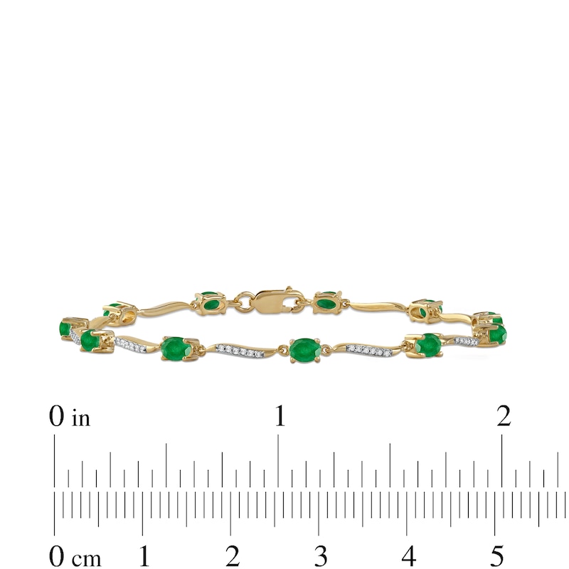 Oval Emerald and 1/6 CT. T.W. Diamond Wave Link Alternating Line Bracelet in 14K Gold – 7.25"