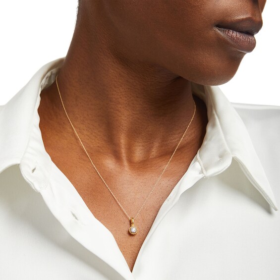 1/6 CT. Diamond Solitaire Bead Frame Drop Pendant in 10K Gold (I/I3)