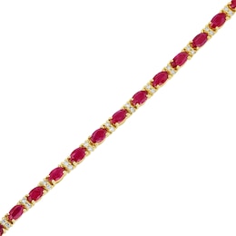 Oval Ruby and 1/2 CT. T.W. Diamond Alternating Line Bracelet in 14K Gold