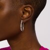Thumbnail Image 2 of 1/2 CT. T.W. Diamond Twist Oval Hoop Earrings in Sterling Silver