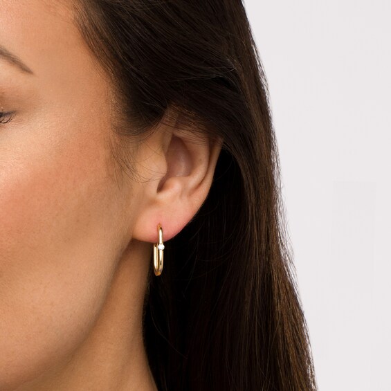 1/10 CT. T.w. Diamond Solitaire Oval Hoop Earrings in 10K Gold