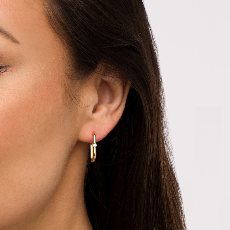 Main Image 2 of 1/10 CT. T.W. Diamond Solitaire Oval Hoop Earrings in 10K Gold