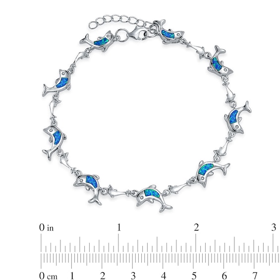 Blue Lab-Created Opal Inlay Dolphin Station Link Bracelet in Sterling Silver