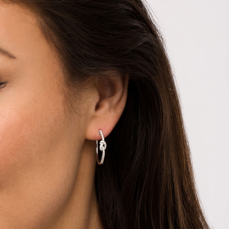Main Image 2 of 1/3 CT. T.W. Diamond Pretzel Knot Hoop Earrings in Sterling Silver