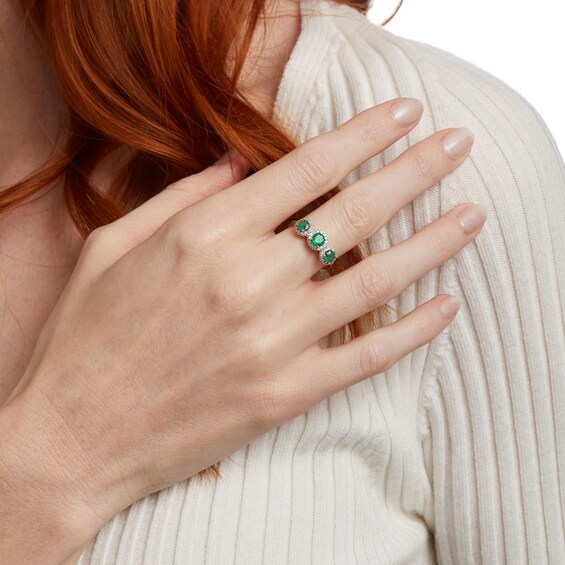 4.5mm Emerald and 1/5 CT. T.w. Diamond Frame Three Stone Ring in 14K Gold