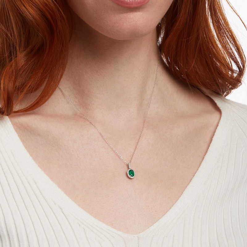 Main Image 2 of Oval Emerald and 1/8 CT. T.W. Diamond Frame Pendant in 14K White Gold