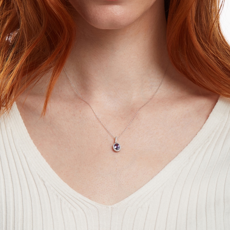Main Image 2 of Oval Tanzanite and 1/8 CT. T.W. Diamond Frame Pendant in 14K White Gold