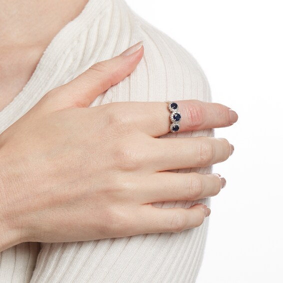 4.5mm Blue Sapphire and 1/5 CT. T.w. Diamond Three Stone Frame Ring in 14K White Gold