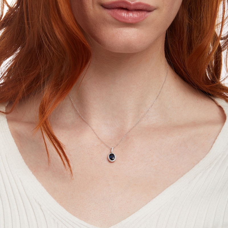 Main Image 2 of Oval Blue Sapphire and 1/8 CT. T.W. Diamond Frame Pendant in 14K White Gold