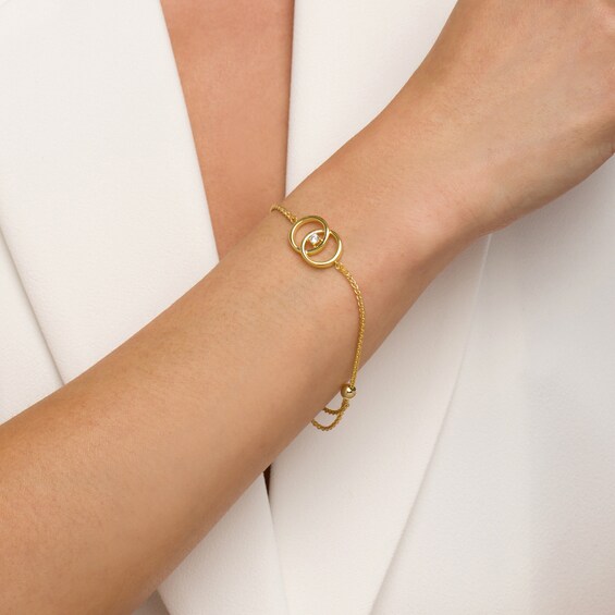 You Me Us 1/10 CT. Diamond Solitaire Intertwined Double Circle Bolo Bracelet in 10K Gold â 9"