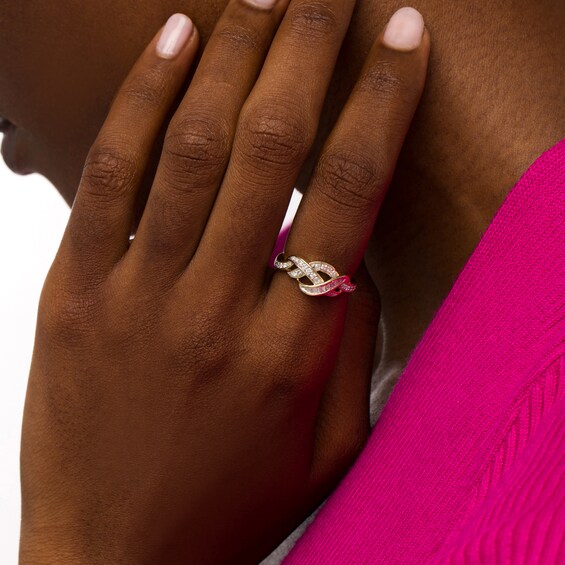 1/4 CT. T.w. Baguette and Round Diamond Twist Ring in 10K Gold