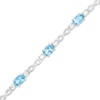 Thumbnail Image 1 of Oval Swiss Blue Topaz and White Lab-Created Sapphire Alternating Infinity Loop Link Bracelet in Sterling Silver – 7.25"