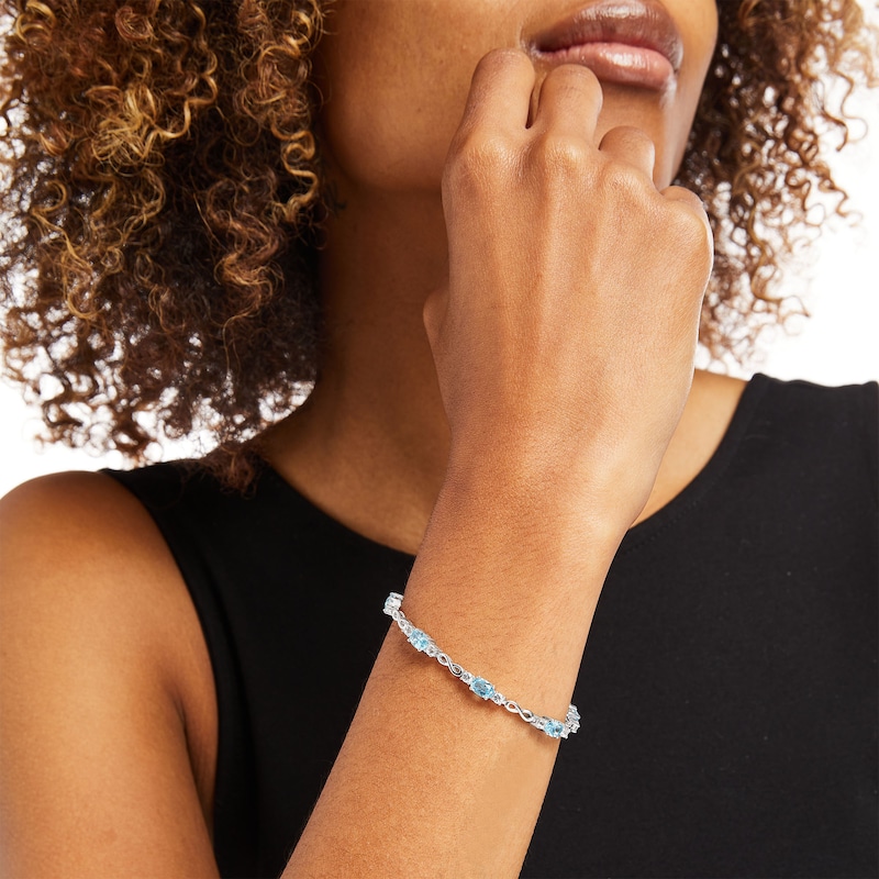 Main Image 2 of Oval Swiss Blue Topaz and White Lab-Created Sapphire Alternating Infinity Loop Link Bracelet in Sterling Silver – 7.25"