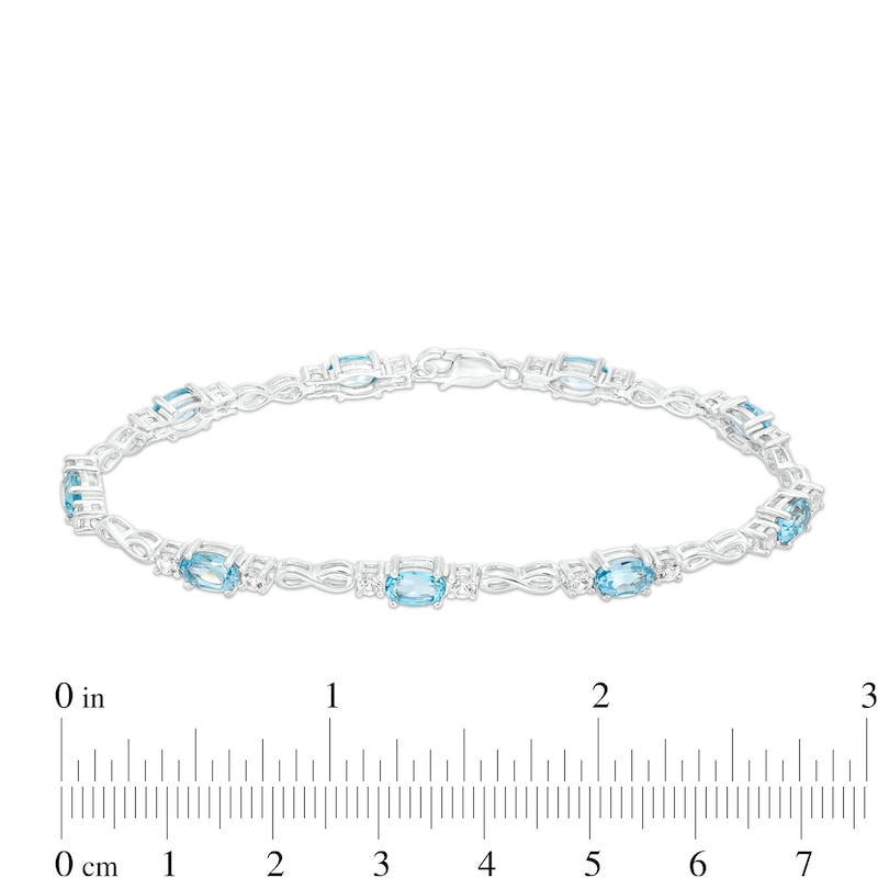 Main Image 4 of Oval Swiss Blue Topaz and White Lab-Created Sapphire Alternating Infinity Loop Link Bracelet in Sterling Silver – 7.25"