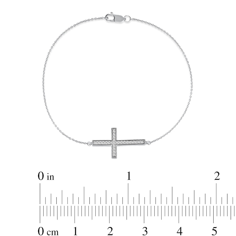 Main Image 4 of 1/8 CT. T.W. Diamond Sideways Cross Bracelet in 10K White Gold - 7.25"