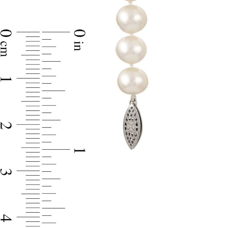 A Strand Of 8 MM Cultured Pearls With Diamond Clasp