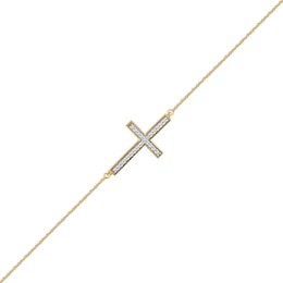 1/8 CT. T.W. Diamond Sideways Cross Bracelet in 10K Gold - 7.25"