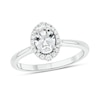 Thumbnail Image 1 of Oval White Lab-Created Sapphire and 1/6 CT. T.W. Diamond Frame Engagement Ring in 10K White Gold