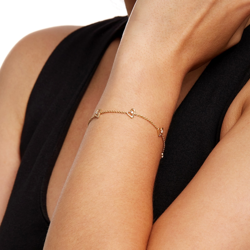 Main Image 2 of Two in Love 1/10 CT. T.W. Diamond Tilted Loop Heart Station Bracelet in 10K Gold – 7.5"
