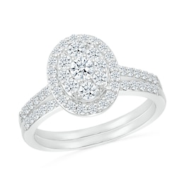 1 CT. T.W. Oval-Shaped Multi-Diamond Frame Bridal Set in 10K White Gold