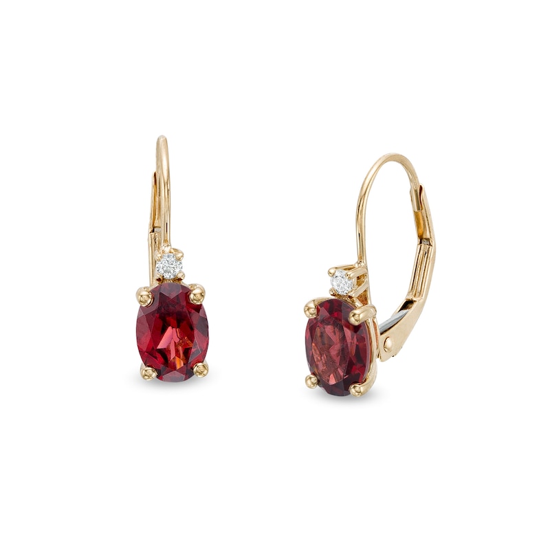 Main Image 1 of Oval Garnet and 1/20 CT. T.W. Diamond Drop Earrings in 10K Gold