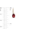 Thumbnail Image 3 of Oval Garnet and 1/20 CT. T.W. Diamond Drop Earrings in 10K Gold