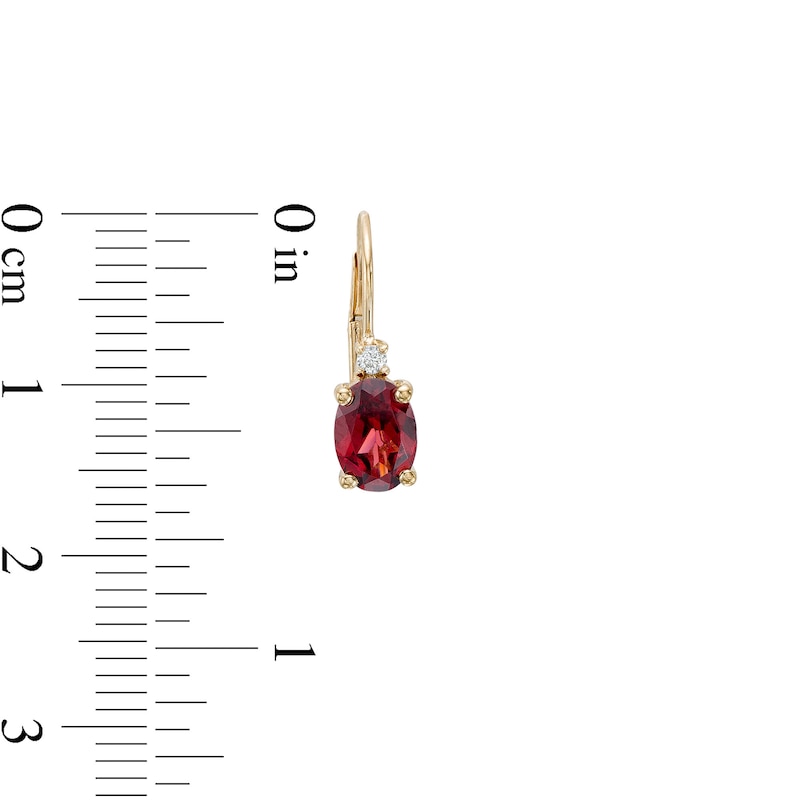 Main Image 3 of Oval Garnet and 1/20 CT. T.W. Diamond Drop Earrings in 10K Gold