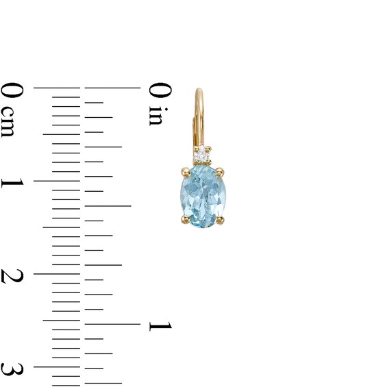 Oval Aquamarine and 1/20 CT. T.w. Diamond Drop Earrings in 10K Gold