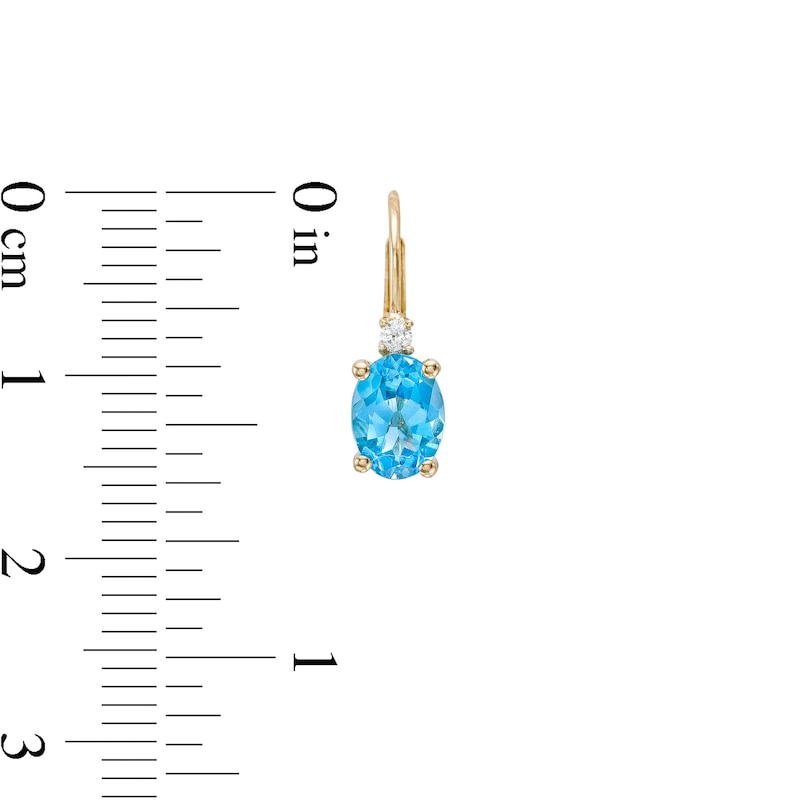 Main Image 3 of Oval Swiss Blue Topaz and 1/20 CT. T.W. Diamond Drop Earrings in 10K Gold