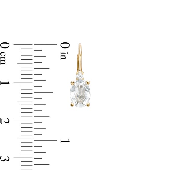 Oval White Topaz and 1/20 CT. T.w. Diamond Drop Earrings in 10K Gold