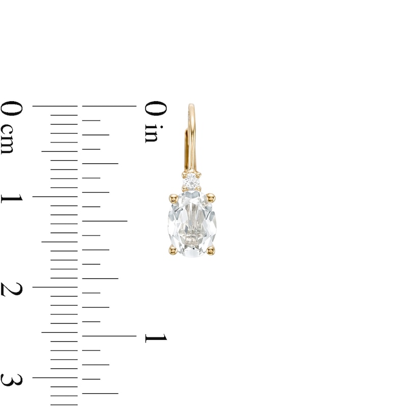 Oval White Topaz and 1/20 CT. T.W. Diamond Drop Earrings in 10K Gold