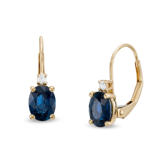 Oval Blue Sapphire and 1/20 CT. T.w. Diamond Drop Earrings in 10K Gold