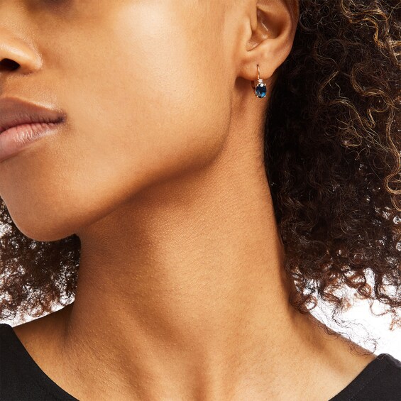 Oval Blue Sapphire and 1/20 CT. T.w. Diamond Drop Earrings in 10K Gold