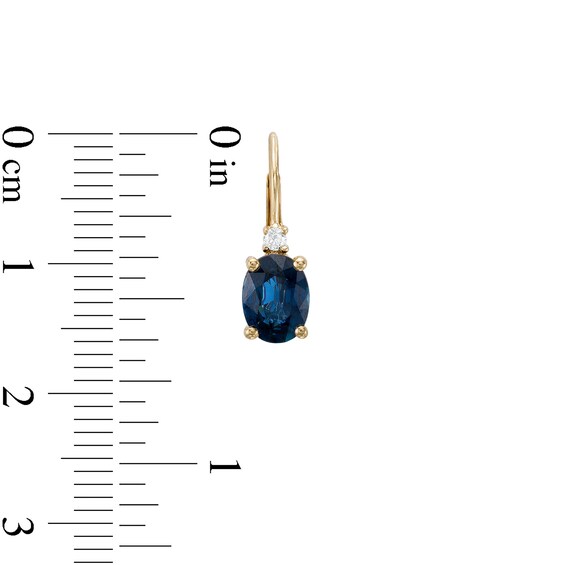Oval Blue Sapphire and 1/20 CT. T.w. Diamond Drop Earrings in 10K Gold