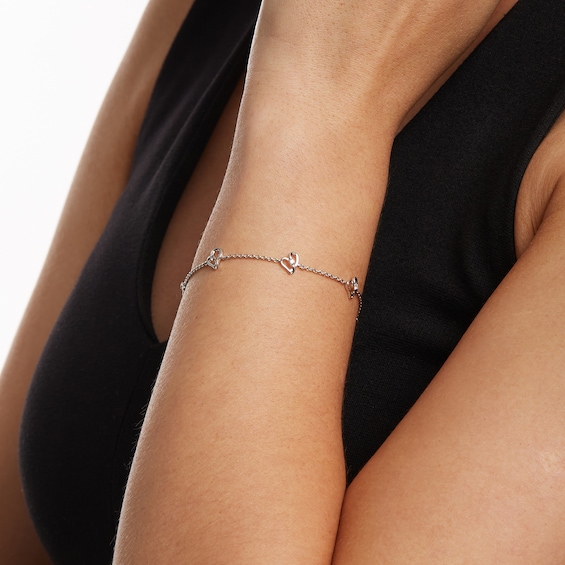 Two in Love 1/10 CT. T.w. Diamond Tilted Loop Heart Station Bracelet in 10K White Gold â 7.5"
