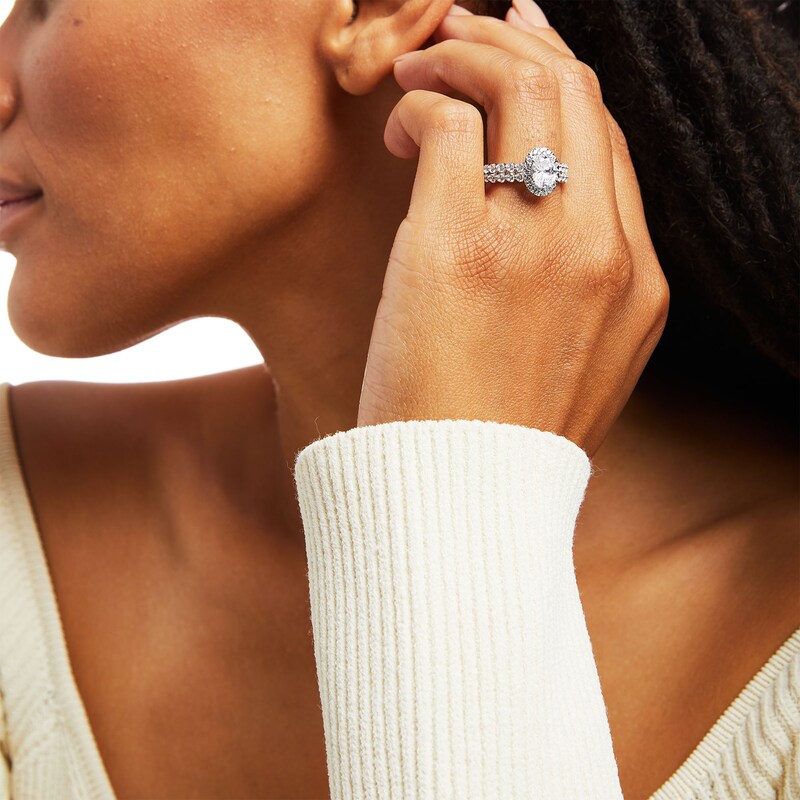 Main Image 2 of Celebration Ideal 2 CT. T.W. Oval Certified Diamond Frame Double Scallop Edge Shank Engagement Ring in 14K White Gold (I/I1)