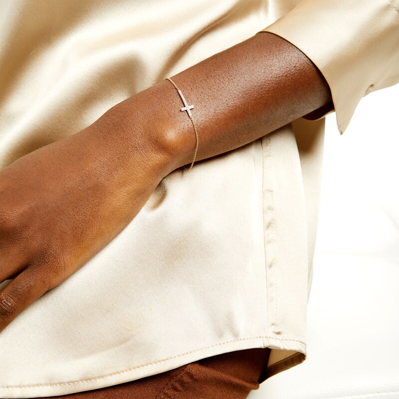 Main Image 2 of 1/6 CT. T.W. Diamond Sideways Cross Bracelet in 10K Gold – 7.5"