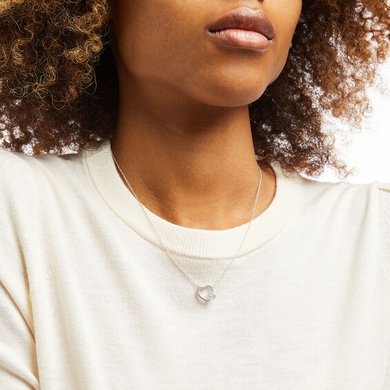 1/8 CT. T.W Diamond Double Heart Necklace in Sterling Silver