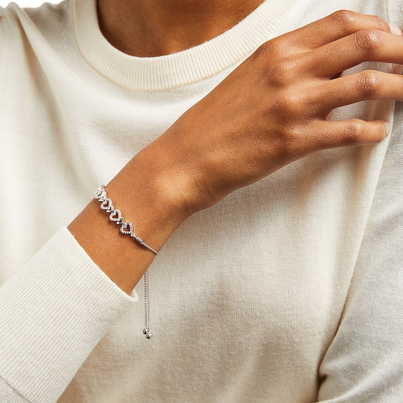 Main Image 2 of 1/20 CT. T.W. Diamond Five Open Hearts Bolo Bracelet in Sterling Silver - 9.5"