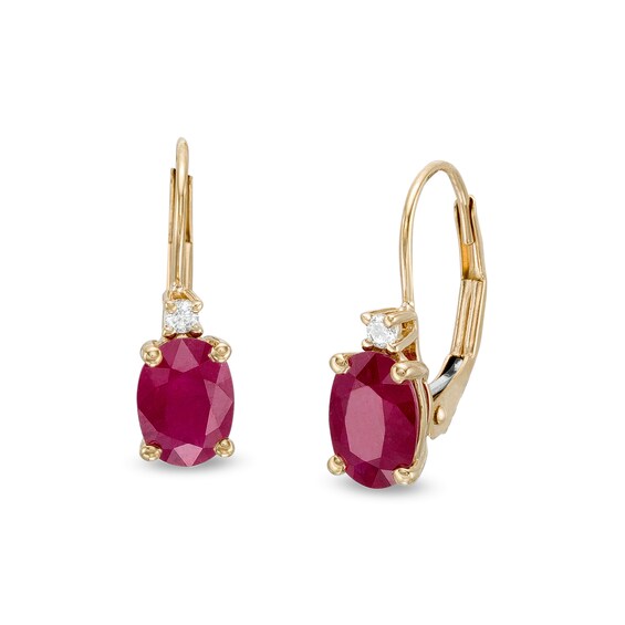 Oval Ruby and 1/20 CT. T.w. Diamond Drop Earrings in 10K Gold