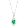 Thumbnail Image 0 of Oval Emerald and 1/6 CT. T.W. Diamond Frame Pendant in 10K White Gold