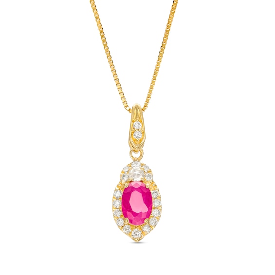 Oval Ruby and 1/6 CT. T.w. Diamond Frame Pendant in 10K Gold