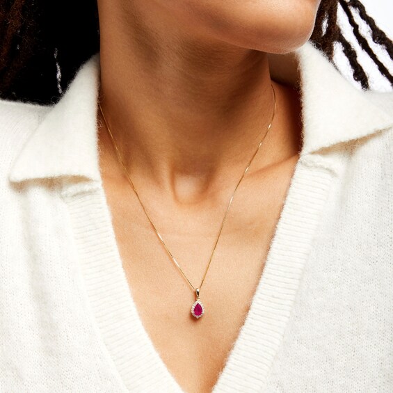 Pear-Shaped Ruby and 1/6 CT. T.w. Diamond Frame Pendant in 10K Gold
