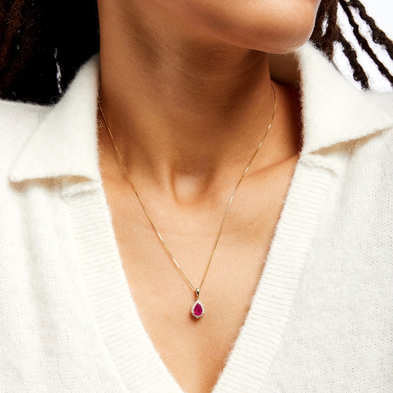 Main Image 2 of Pear-Shaped Ruby and 1/6 CT. T.W. Diamond Frame Pendant in 10K Gold