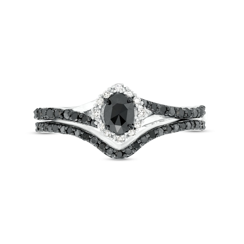 1/2 CT. T.W. Oval Black and White Diamond Frame Split Shank Bridal Set in 10K White Gold